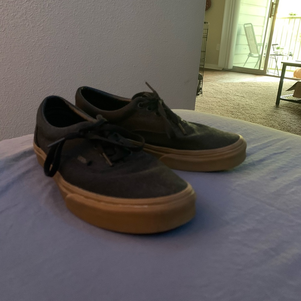 Low black vans with gum bottoms